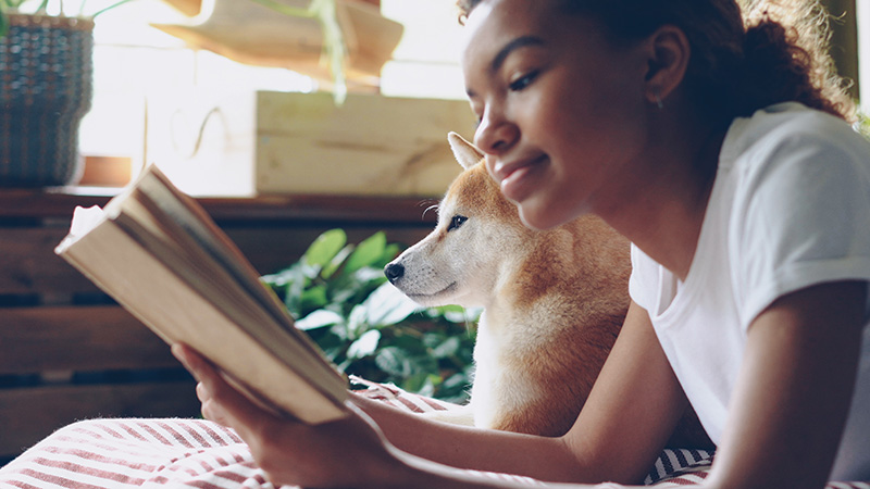 girl and dog reading poetry