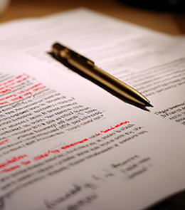 manuscript revision with red type and handwritten notes